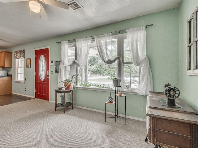 2028 Carlisle Rd, The Village, OK 73120 - carpeted entryway featuring ceiling fan, a textured ceiling, and a textured wall