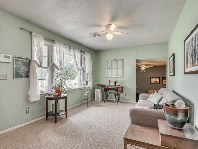 2028 Carlisle Rd, The Village, OK 73120 - living area featuring a ceiling fan, carpet floors, and a textured ceiling