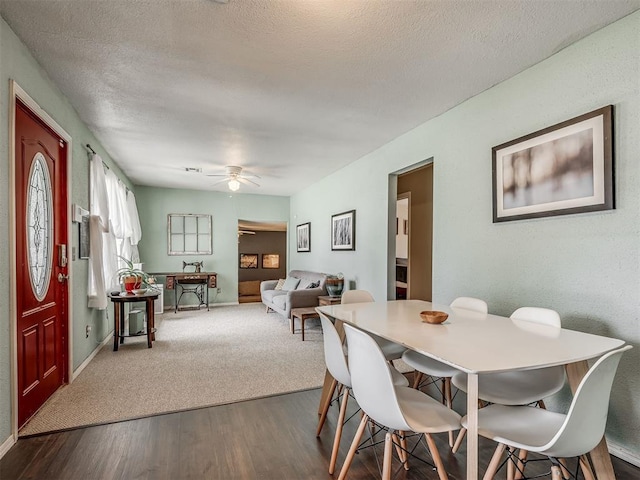 2028 Carlisle Rd, The Village, OK 73120 - dining area with dark wood-type flooring, ceiling fan, and a textured ceiling