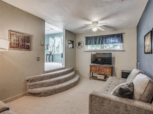 2028 Carlisle Rd, The Village, OK 73120 - living room with a textured wall, carpet, plenty of natural light, a ceiling fan, and a textured ceiling