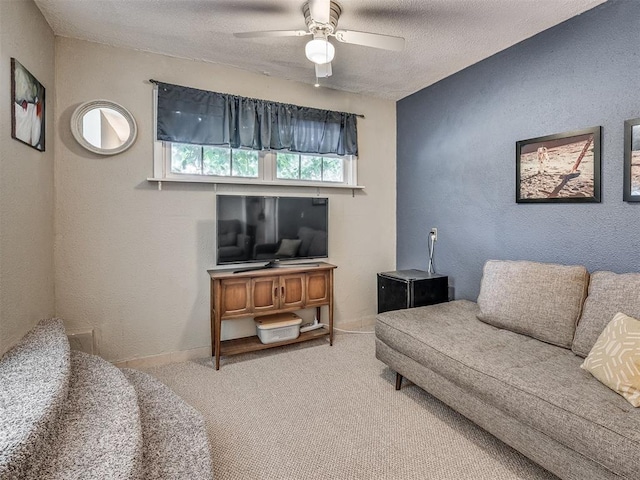 2028 Carlisle Rd, The Village, OK 73120 - living area with ceiling fan, carpet flooring, a textured ceiling, and a textured wall