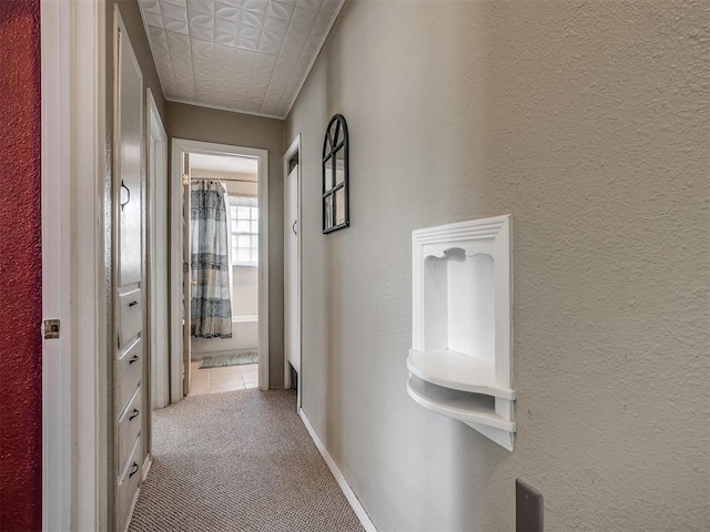 2028 Carlisle Rd, The Village, OK 73120 - corridor featuring carpet floors, an ornate ceiling, and a textured wall