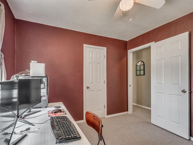 2028 Carlisle Rd, The Village, OK 73120 - carpeted home office featuring a ceiling fan, a textured wall, and a textured ceiling