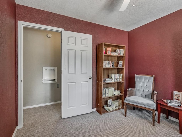 2028 Carlisle Rd, The Village, OK 73120 - living area featuring carpet flooring, a textured wall, a ceiling fan, and a textured ceiling