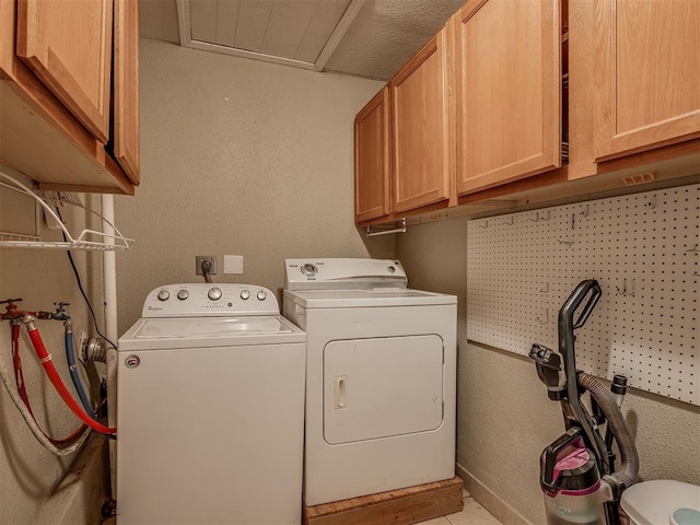 2028 Carlisle Rd, The Village, OK 73120 - laundry area featuring cabinet space and washer and clothes dryer