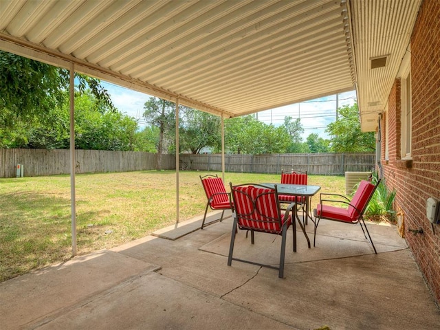 2028 Carlisle Rd, The Village, OK 73120 - fenced backyard with outdoor dining area and a patio area