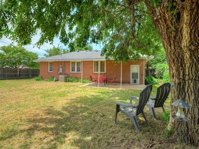 2028 Carlisle Rd, The Village, OK 73120 - back of house featuring brick siding and a patio