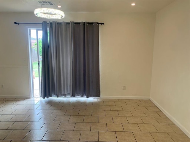 2928 N Downing Ave, Bethany, OK 73008 - spare room featuring baseboards and recessed lighting