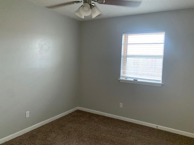 2928 N Downing Ave, Bethany, OK 73008 - unfurnished room featuring ceiling fan and dark carpet