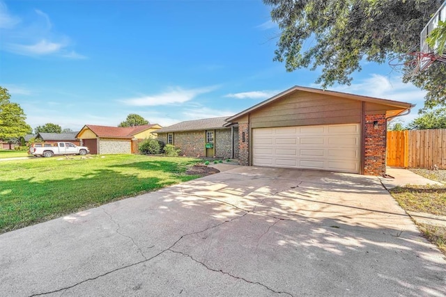 224 N Quail Run, Altus, OK 73521 - ranch-style home with a garage, driveway, and brick siding