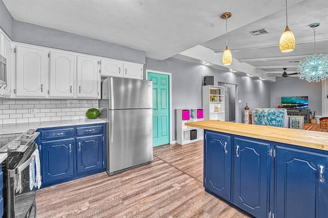 224 N Quail Run, Altus, OK 73521 - kitchen with freestanding refrigerator, electric range, light wood-style flooring, blue cabinets, and light countertops