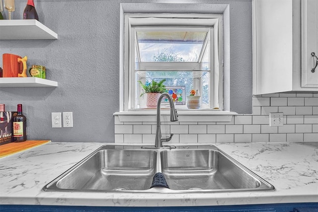 224 N Quail Run, Altus, OK 73521 - kitchen view of open shelves, tasteful backsplash, and white cabinets
