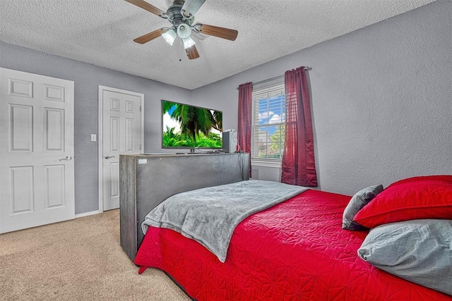 224 N Quail Run, Altus, OK 73521 - carpeted bedroom featuring a textured wall, a textured ceiling, and a ceiling fan
