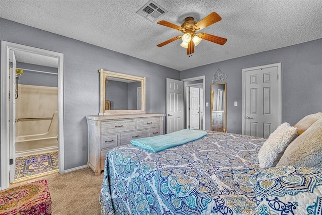 224 N Quail Run, Altus, OK 73521 - bedroom with light carpet, a textured ceiling, ceiling fan, and a textured wall