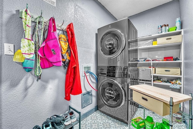 224 N Quail Run, Altus, OK 73521 - laundry room with estacked washer and dryer and a textured wall
