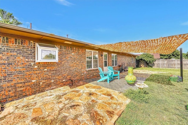 224 N Quail Run, Altus, OK 73521 - fenced backyard with a patio area