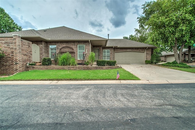 1900 NW 159th Pl, Edmond, OK 73013 - view of front of property with an attached garage, brick siding, concrete driveway, and a front yard