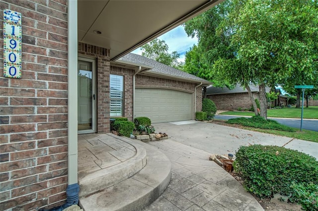 1900 NW 159th Pl, Edmond, OK 73013 - view of patio / terrace with concrete driveway and a garage