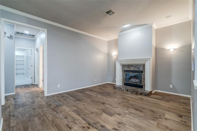 1900 NW 159th Pl, Edmond, OK 73013 - unfurnished living room with wood finished floors, crown molding, and a premium fireplace