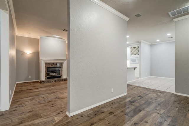 1900 NW 159th Pl, Edmond, OK 73013 - corridor featuring ornamental molding, wood finished floors, recessed lighting, and a textured wall