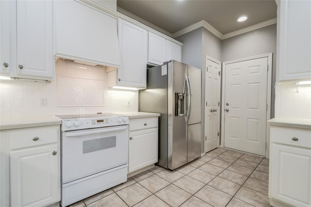 1900 NW 159th Pl, Edmond, OK 73013 - kitchen with electric range, stainless steel fridge, ornamental molding, white cabinetry, and backsplash