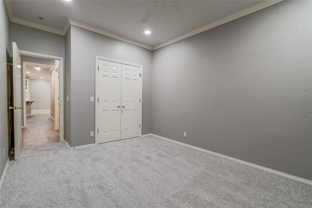 1900 NW 159th Pl, Edmond, OK 73013 - unfurnished bedroom with crown molding, carpet, a closet, a ceiling fan, and recessed lighting