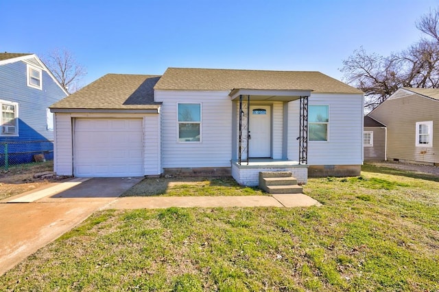 2132 N Rhode Island Ave, Oklahoma City, OK 73111 - view of front facade featuring concrete driveway, roof with shingles, a front yard, and a garage