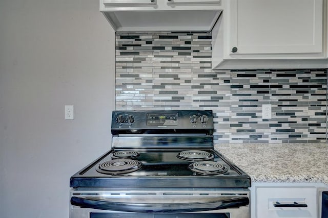2132 N Rhode Island Ave, Oklahoma City, OK 73111 - kitchen with electric range, decorative backsplash, ventilation hood, white cabinetry, and light stone counters