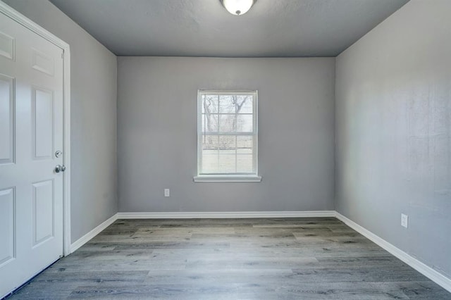 2132 N Rhode Island Ave, Oklahoma City, OK 73111 - unfurnished room featuring wood finished floors and baseboards
