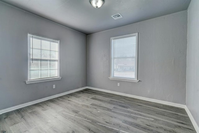 2132 N Rhode Island Ave, Oklahoma City, OK 73111 - spare room featuring wood finished floors and baseboards