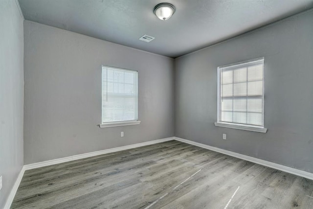 2132 N Rhode Island Ave, Oklahoma City, OK 73111 - unfurnished room with wood finished floors and baseboards