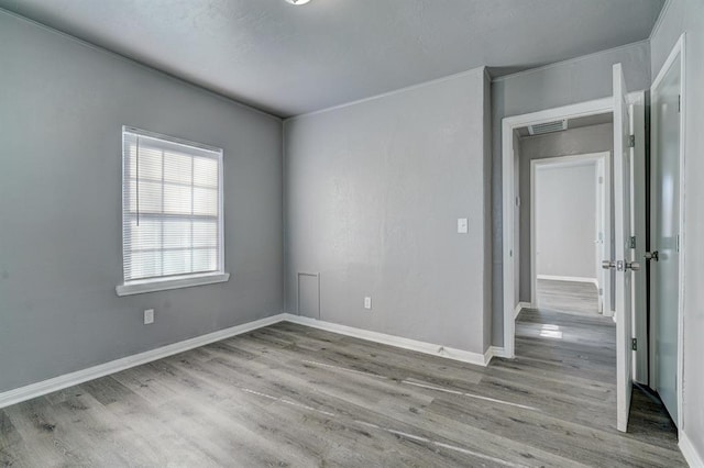 2132 N Rhode Island Ave, Oklahoma City, OK 73111 - unfurnished room with wood finished floors and baseboards