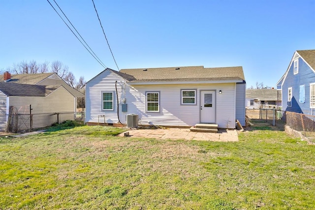 2132 N Rhode Island Ave, Oklahoma City, OK 73111 - back of house with a fenced backyard, a shingled roof, and entry steps