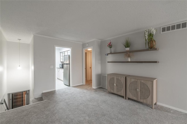 6100 N Brookline Ave Unit 20, Oklahoma City, OK 73112 - unfurnished living room with a textured ceiling, crown molding, and carpet floors