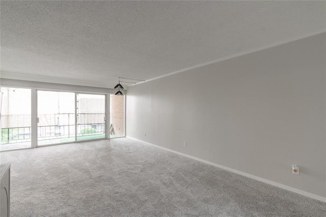 6100 N Brookline Ave Unit 20, Oklahoma City, OK 73112 - carpeted empty room featuring baseboards and a textured ceiling