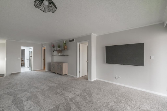 6100 N Brookline Ave Unit 20, Oklahoma City, OK 73112 - unfurnished living room with crown molding, carpet flooring, and a textured ceiling