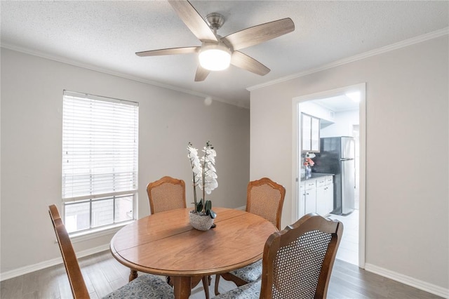 6100 N Brookline Ave Unit 20, Oklahoma City, OK 73112 - dining space with a ceiling fan, wood finished floors, crown molding, and a textured ceiling