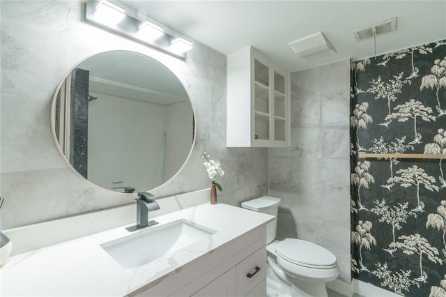 6100 N Brookline Ave Unit 20, Oklahoma City, OK 73112 - bathroom with vanity and tile walls