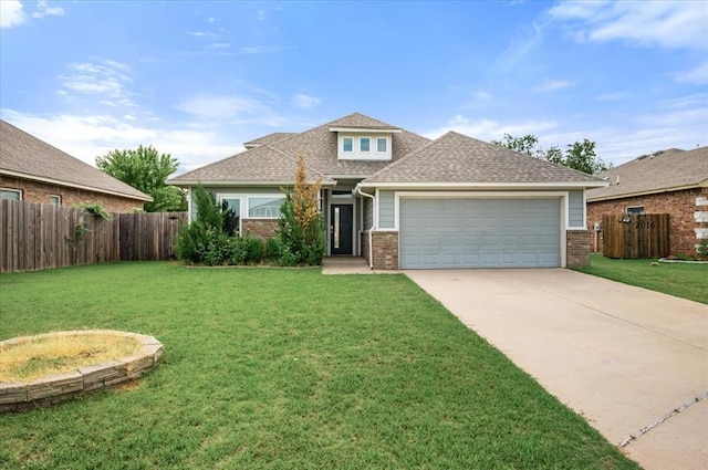 2020 Sara Vista Dr, Yukon, OK 73099 - view of front of house with brick siding, an attached garage, concrete driveway, and a shingled roof