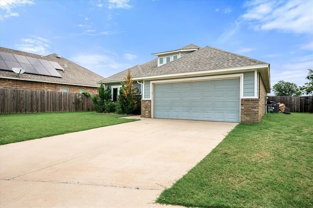 2020 Sara Vista Dr, Yukon, OK 73099 - traditional home with brick siding, concrete driveway, a shingled roof, and a garage