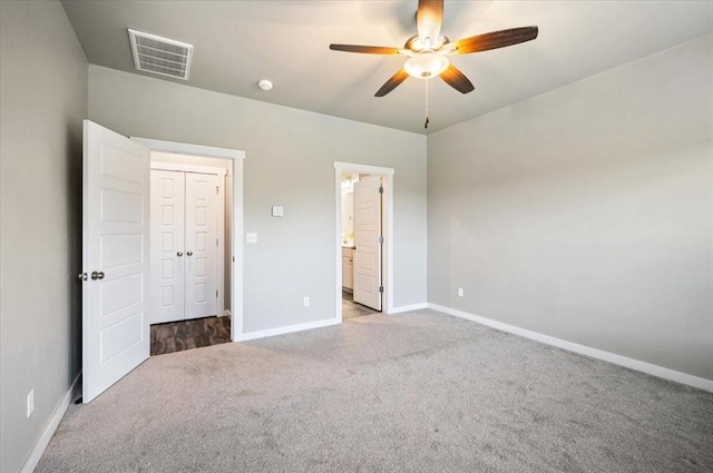 2020 Sara Vista Dr, Yukon, OK 73099 - unfurnished bedroom featuring carpet flooring, ceiling fan, and ensuite bath