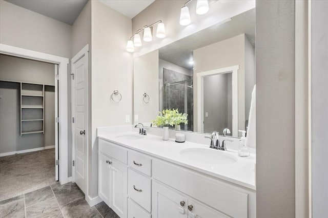 2020 Sara Vista Dr, Yukon, OK 73099 - bathroom featuring double vanity, a stall shower, and a closet
