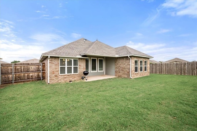 2020 Sara Vista Dr, Yukon, OK 73099 - rear view of house featuring brick siding, a fenced backyard, a patio, and a shingled roof