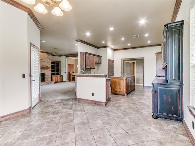 112 Lakeview Ct, Edmond, OK 73003 - kitchen with crown molding, open floor plan, light tile patterned flooring, a center island, and recessed lighting