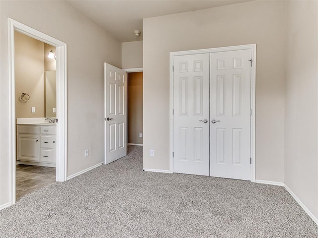 112 Lakeview Ct, Edmond, OK 73003 - unfurnished bedroom featuring carpet flooring, a closet, and ensuite bath