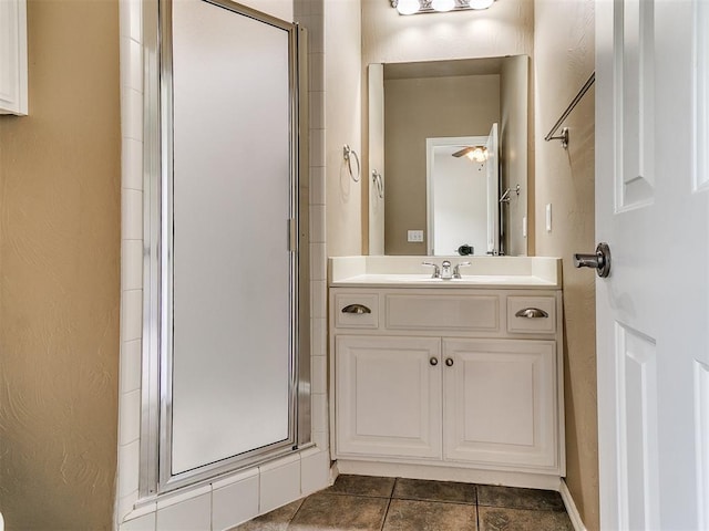 112 Lakeview Ct, Edmond, OK 73003 - bathroom with a stall shower, vanity, and tile patterned flooring