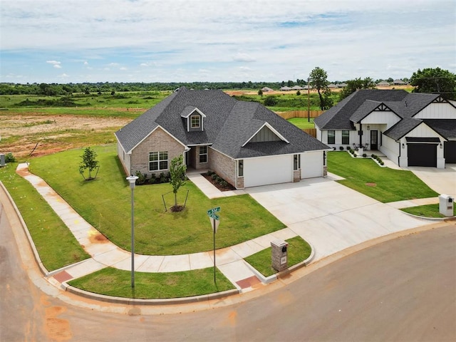 10400 SW 51st St, Mustang, OK 73064 - view of front of home with driveway, a shingled roof, an attached garage, and a front yard