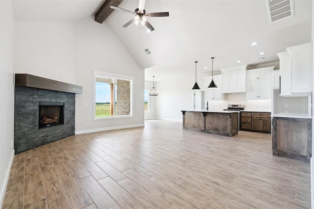 10400 SW 51st St, Mustang, OK 73064 - kitchen featuring open floor plan, beamed ceiling, high vaulted ceiling, light wood-style flooring, and ceiling fan