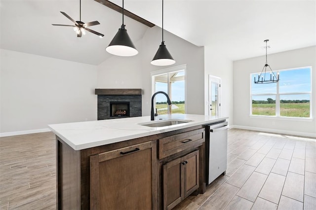 10400 SW 51st St, Mustang, OK 73064 - kitchen featuring open floor plan, dishwasher, wood finish floors, pendant lighting, and a fireplace
