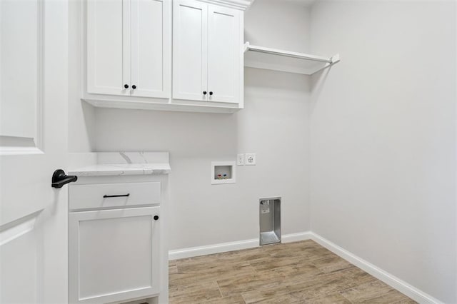 10400 SW 51st St, Mustang, OK 73064 - laundry room with cabinet space, washer hookup, light wood-style floors, and hookup for an electric dryer